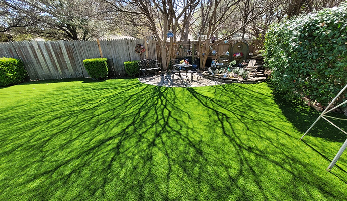 House backyard with installed artificial turf
