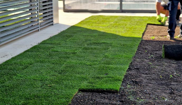 Professional team installing artificial turf