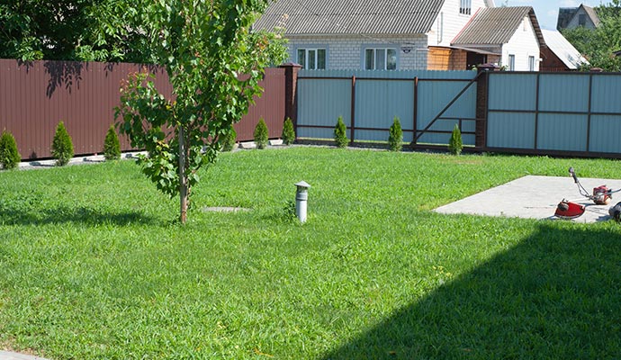 Installed artificial turf enhancing the natural look and feel of the residential backyard area