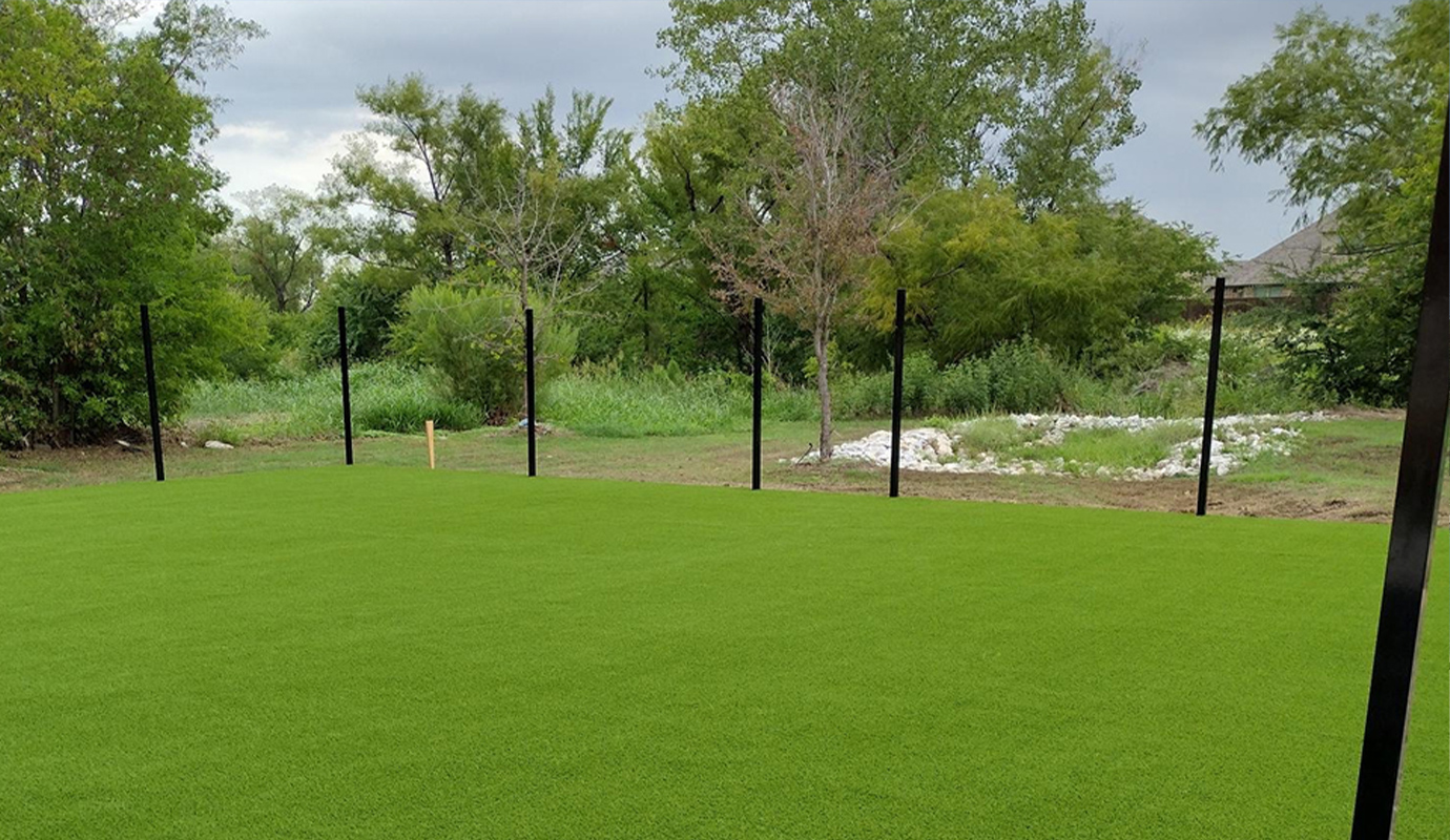 A large outdoor area covered with bright green artificial turf