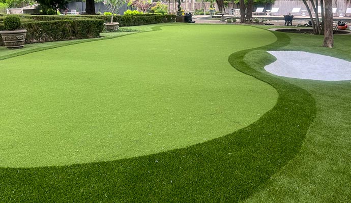 Residential golf field with artificial putting green grass