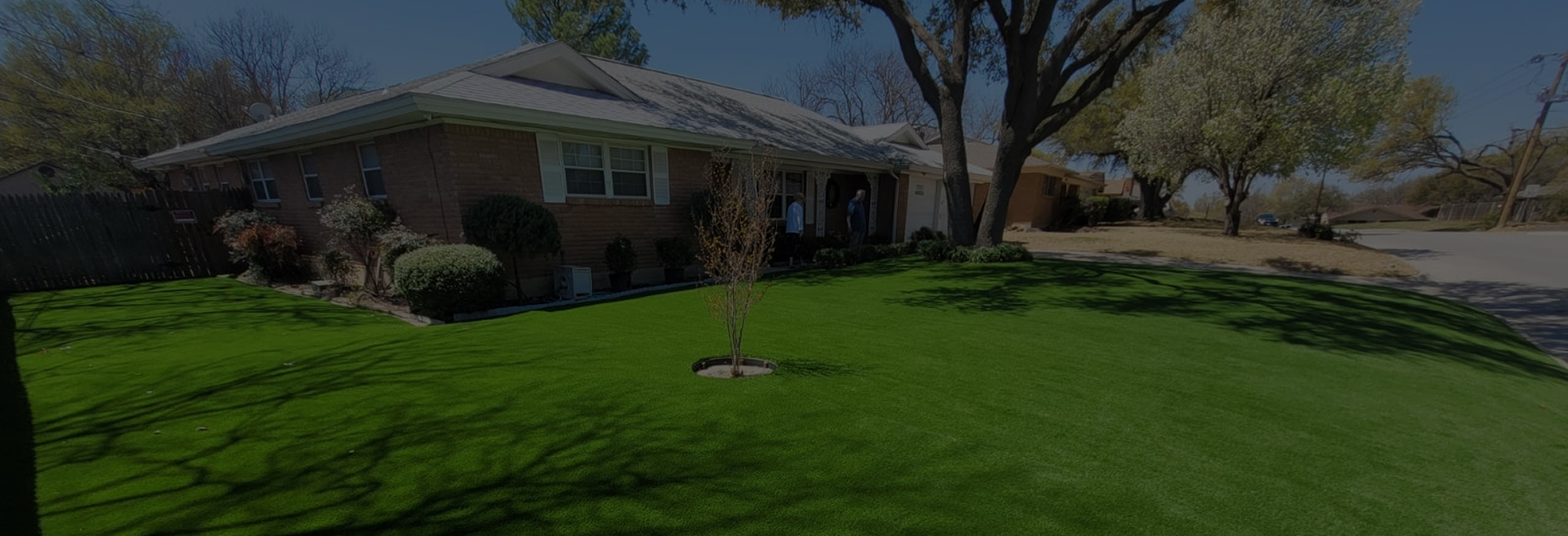 Front yard of residential house with installed artificial turf