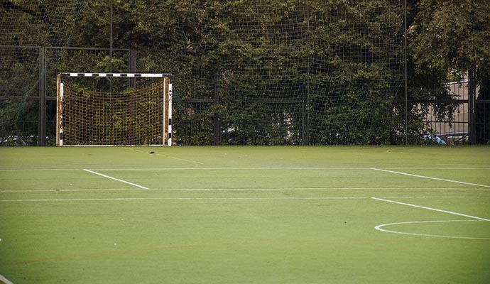 Backyard field with installed artificial turf