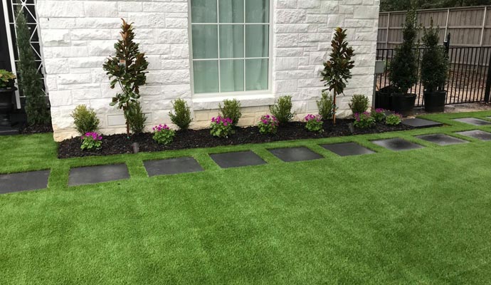 A residential front-yard with artificial turf