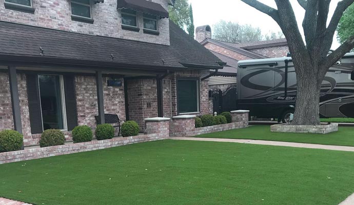 Residential front yard with installed artificial turf